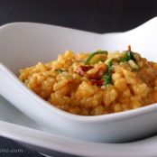 Risoto com tomate seco e rúcula